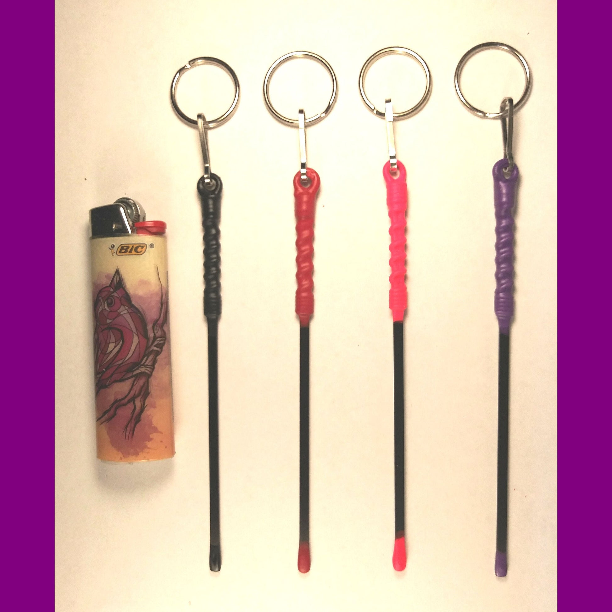  keychains, rods, and a lighter on a white background